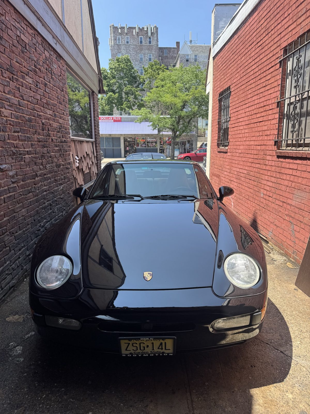 Freshly detailed black Porsche 928 exterior